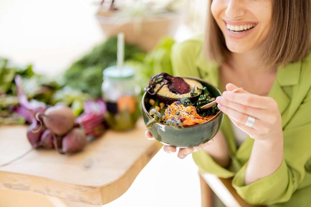 1688020849 relaxed woman with healthy food room with plants 1688286594 585